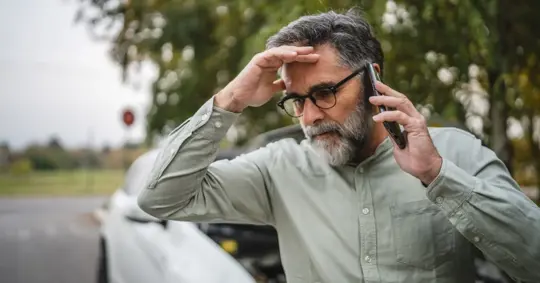 worried man in a car accident